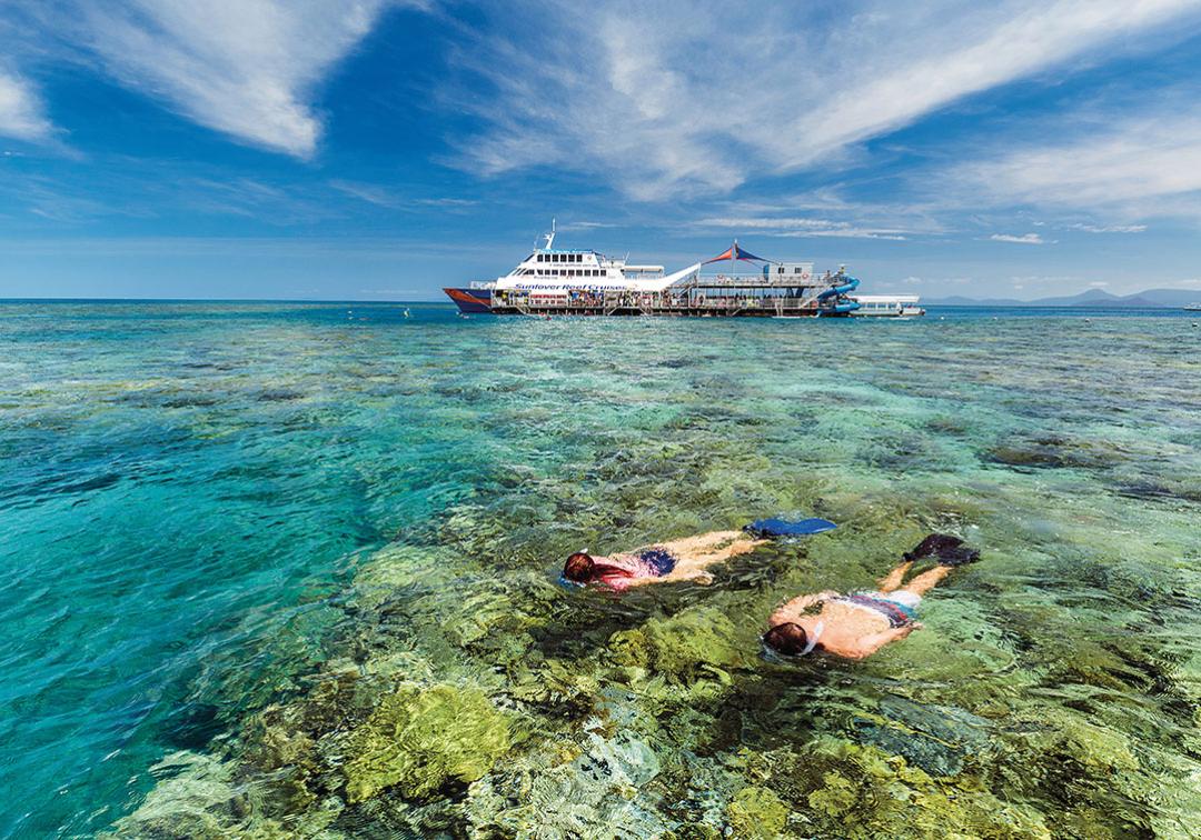 Two people snorkelling on the Great Barrier Reef. Image credit: Tourism and Events Queensland