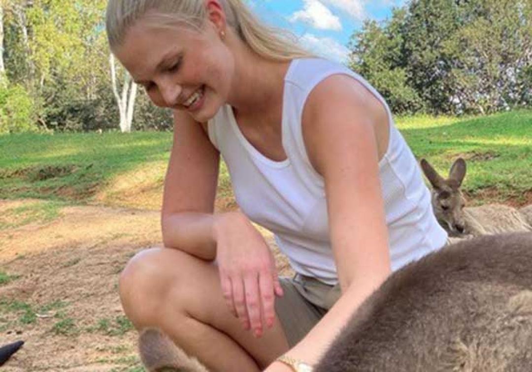 Amelia Groenseth patting kangaroos