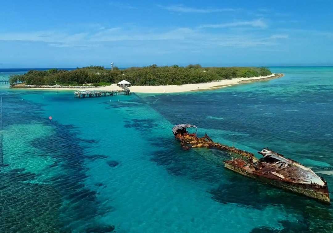 Aerial image of a shipwreck over the reef at Heron Island research station