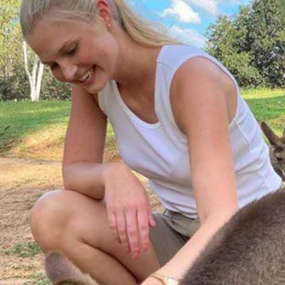 Amelia Groenseth patting kangaroos