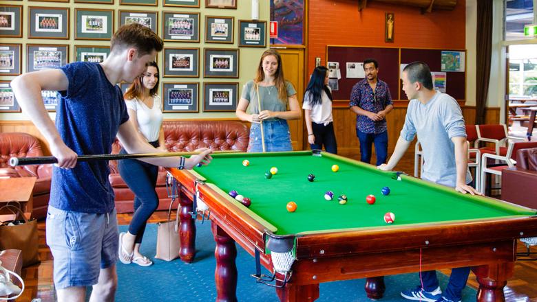 Students playing pool at one of The University of Queensland's on-campus residential colleges.