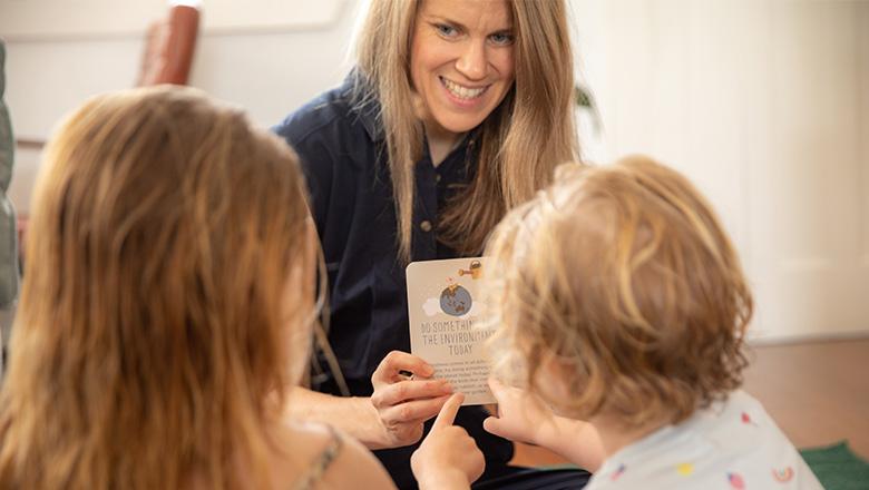 Dr Emma Crawford shows flashcards to children