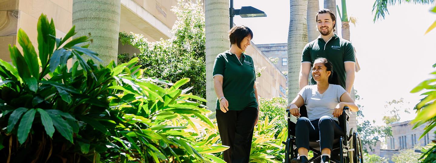 Occupational therapists walking with patient