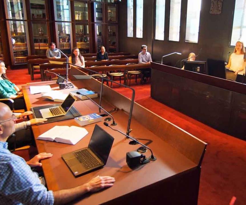 A student participates in a mock trial in the UQ law Moot Court